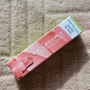 W3ll People Poutlove Peptide Lip Balm in PINK GRAPEFRUIT